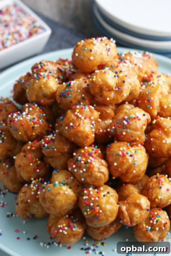 Golden Struffoli: Italian Honey Delights 12 The struffoli when finished looks great on a pile with sprinkles ready to be enjoyed.