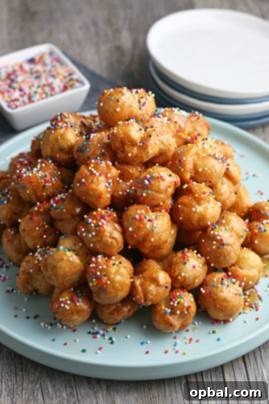 Golden Struffoli: Italian Honey Delights 3 A view of the finished Italian honey balls piled up and decorated ready to be enjoyed.