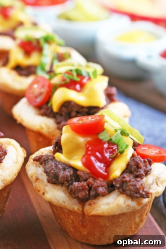 Cheeseburger Biscuit Poppers 12 Another enticing view of the finished cheeseburger biscuit bites, beautifully arranged on a serving plate, inviting hungry eaters to grab one.