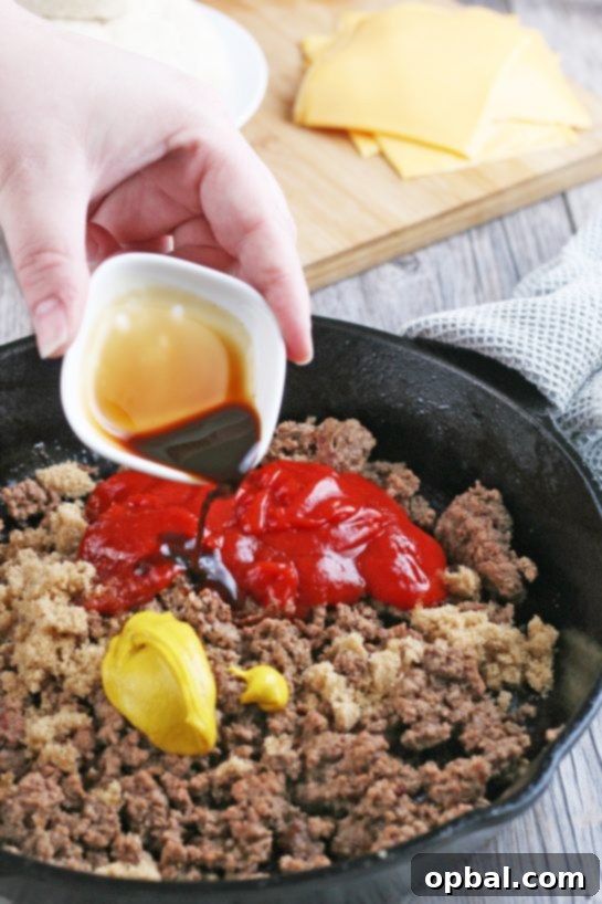 Cheeseburger Biscuit Poppers 6 The cooked ground beef, now seasoned with ketchup, mustard, and brown sugar, creating a rich and flavorful mixture ready to be added to the biscuit cups.