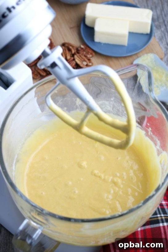 Holiday Spirit Rum Cake 6 The smooth, pale yellow batter for the Bacardi rum cake, perfectly mixed and ready for the bundt pan.