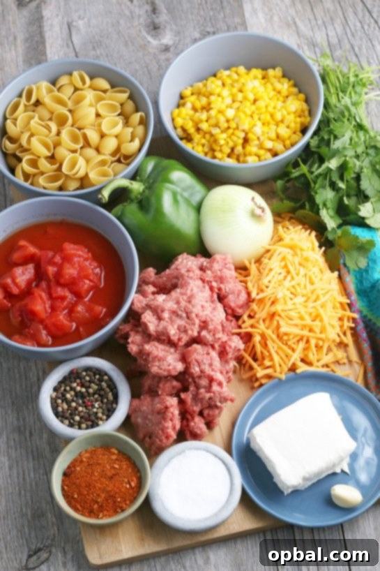 Easy Crockpot Creamy Taco Pasta 4 This is the view of the ingredients needed to make slow cooker taco pasta, laid out neatly on a counter.