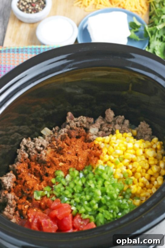 Easy Crockpot Creamy Taco Pasta 7 More seasonings and vegetables go into our Mexican pasta salad as we layer up the slow cooker with vibrant ingredients!