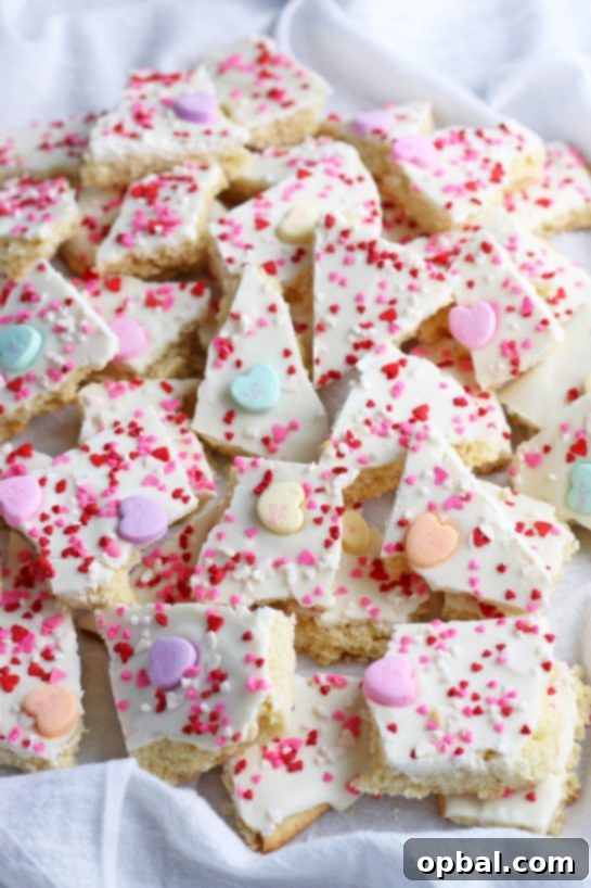 This image shows the completed recipe for conversation hearts cookie bark, a delightful treat for Valentine's Day.