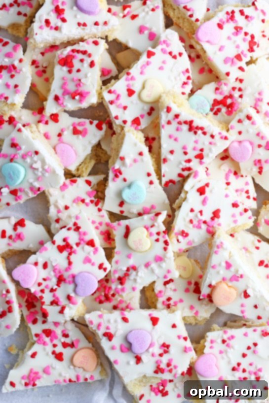 A top-down view of the finished cookie bark, adorned with conversation hearts and sprinkles, ready to be shared.