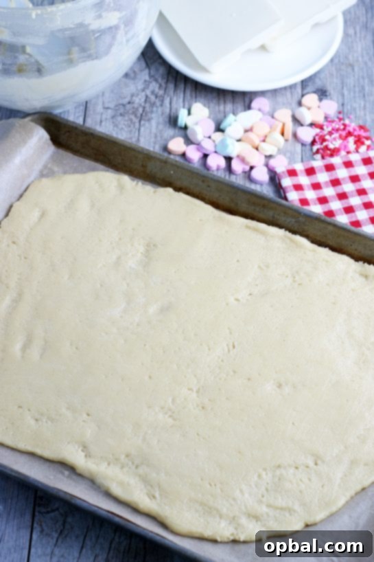 Here is a great sugar cookie dough idea, rolling the sheet of cookie dough out thin so it can be baked is simple and quick, creating a perfect base.