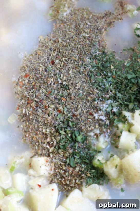 New England's Hearty Clam Bliss 11 This is the step where we add the seasonings to make our homemade clam chowder recipe flavorful and delicious.