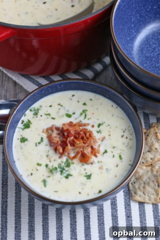 New England's Hearty Clam Bliss 13 A top down view of the finished creamy New England clam chowder soup recipe.