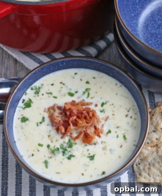 New England's Hearty Clam Bliss 14 A top down view of the finished creamy New England clam chowder soup recipe.