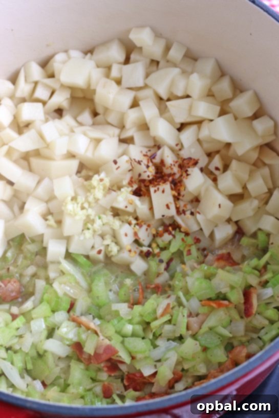 New England's Hearty Clam Bliss 8 Next up we have to add the potatoes and more seasonings for this easy clam chowder recipe.