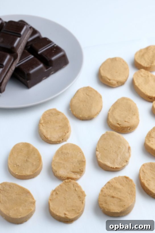 Decadent Chocolate Peanut Butter Eggs 11 The freshly shaped peanut butter eggs are beautifully arranged, poised and ready for their rich chocolate coating.