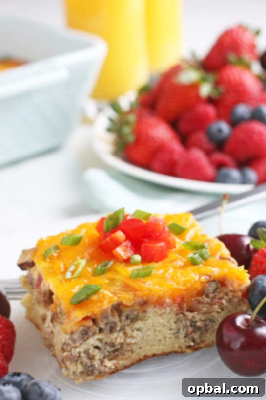 Savory Sleep-In Breakfast Bake 13 A close up shot shows us the side of this breakfast casserole egg and sausage recipe with all the delicious layers on display.