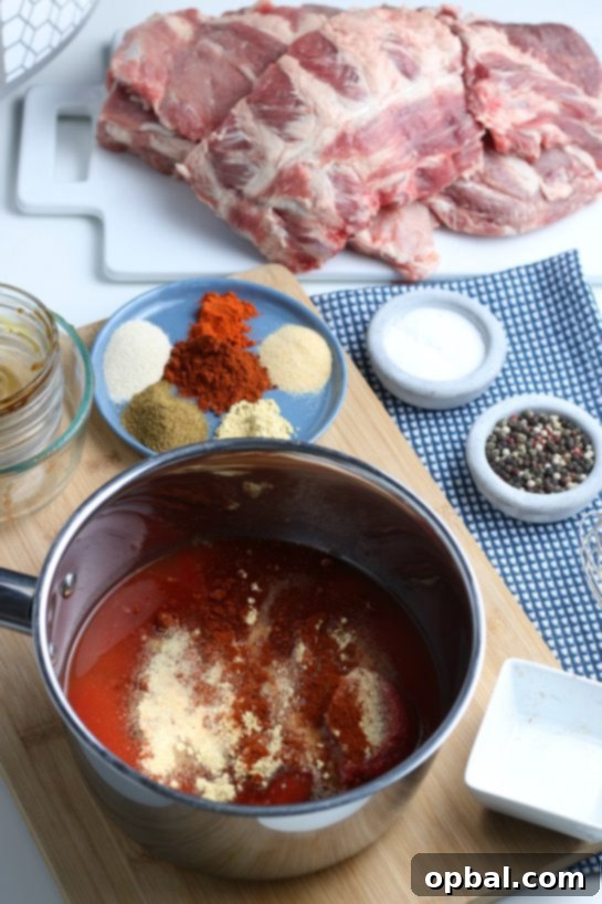 Fall-Off-The-Bone Slow Cooker BBQ Ribs 11 Adding more seasonings and pouring the flavorful homemade sauce over the ribs already placed in the slow cooker.