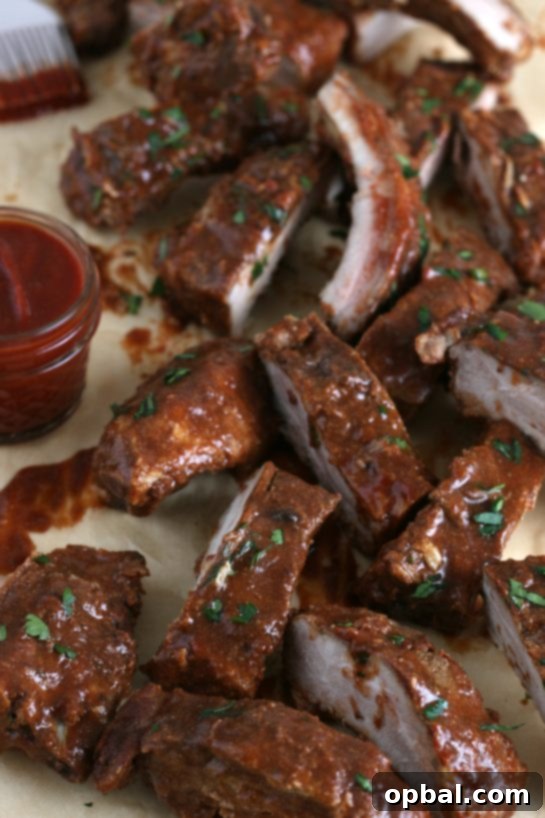 A close-up view of perfectly sectioned slow cooker ribs, highlighting their tenderness and readiness for a delightful meal.