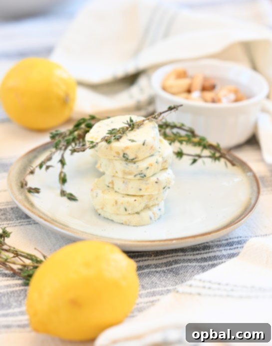 Fire-Kissed Strip Steak with Melting Herb Butter 6 Close-up of herb compound butter, showcasing fresh thyme, minced garlic, and vibrant lemon zest, ready to be prepared.
