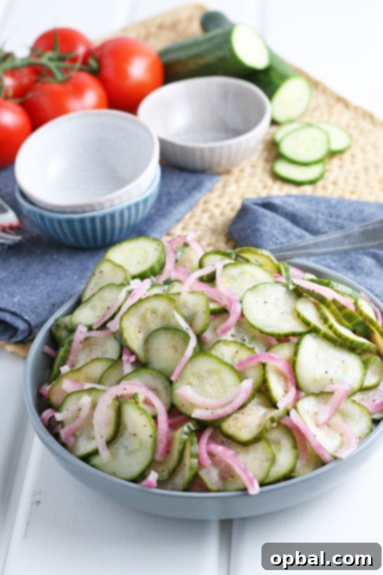 Photo of the finished cucumber salad recipe served in a large serving bowl, highlighting its freshness and appeal.