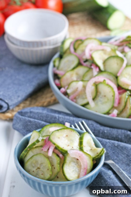Photo of the finished cucumber salad recipe served up in individual bowls, ready for enjoyment.