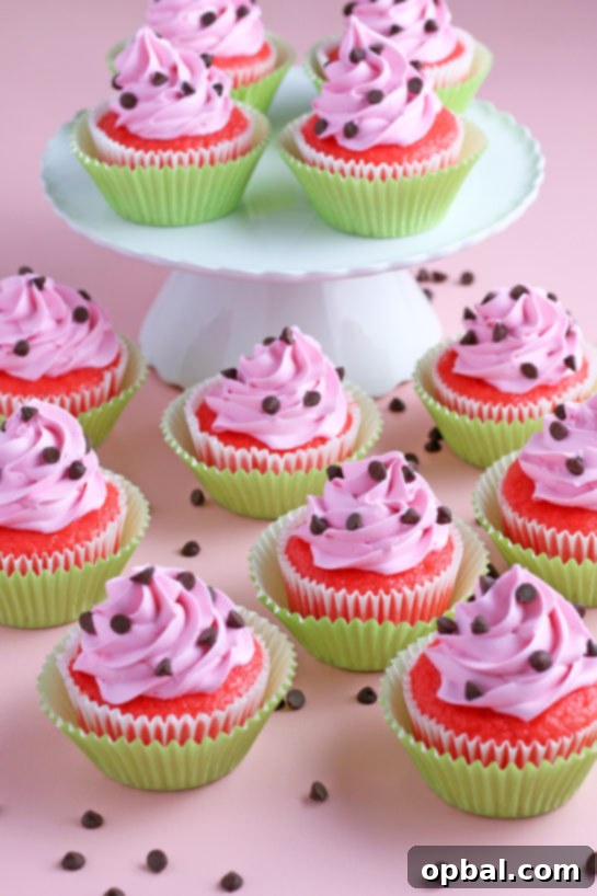 Watermelon Dream Cupcakes 2 Watermelon Cupcakes topped with homemade buttercream! These fluffy vanilla cupcakes are bursting with juicy pockets of watermelon and the hot pink frosting is so pretty and delicious. These are the perfect summer cupcake recipe!
