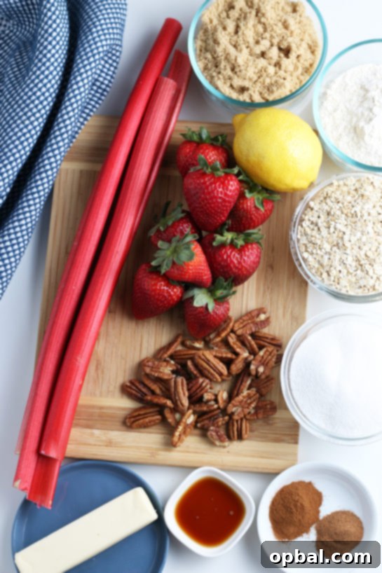 Delicious Strawberry and Rhubarb Crisp 5 Essential ingredients for Strawberry & Rhubarb crisp recipe laid out on a kitchen counter, showcasing fresh produce and pantry staples.