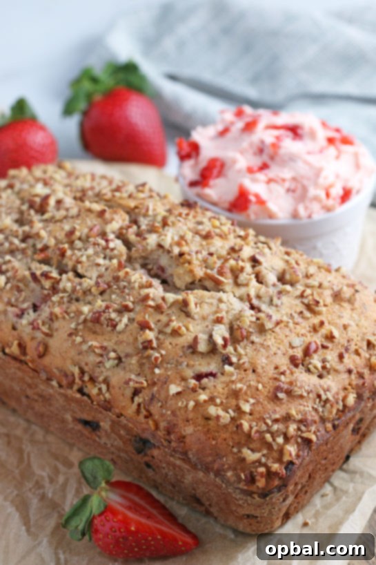 Luscious Strawberry Cream Bread 14 Whole loaf of baked strawberry bread on a wire rack.