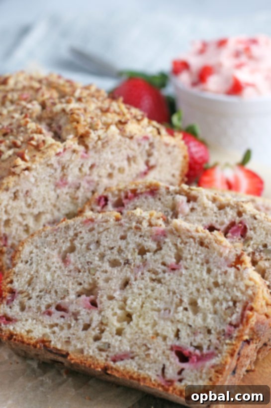 Luscious Strawberry Cream Bread 16 Close-up of several slices of strawberry bread on a serving platter.