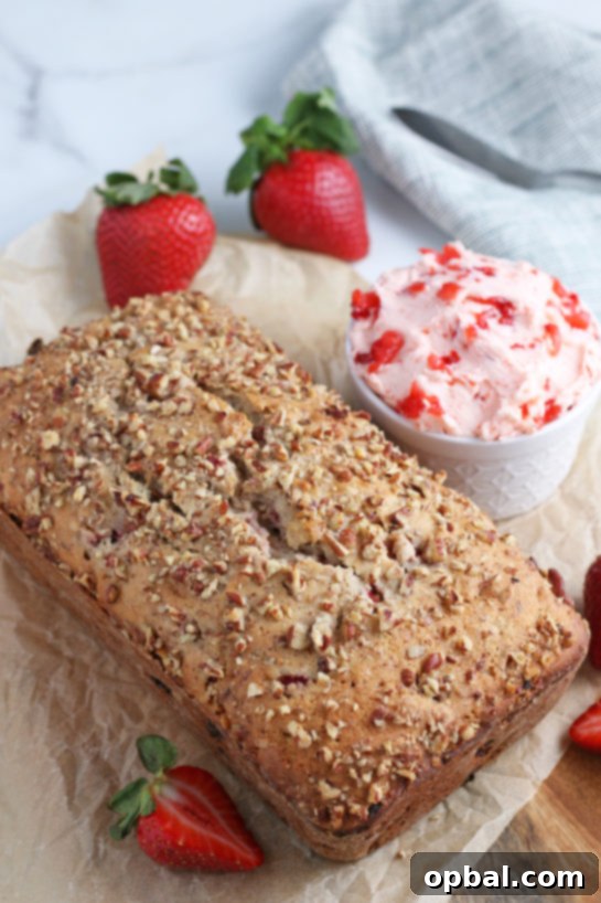 Luscious Strawberry Cream Bread 3 Whole loaf of strawberry and cream bread with fresh strawberry cream cheese, sliced and ready to serve.