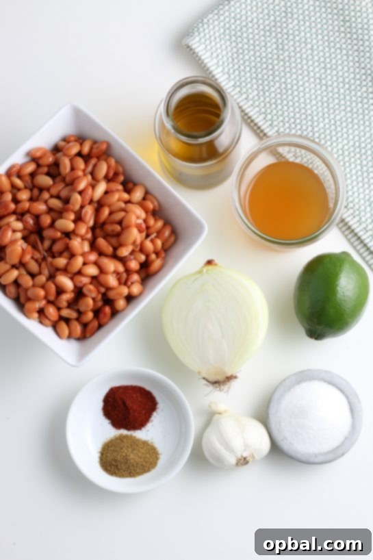 Essential ingredients laid out for making the best homemade refried beans from scratch