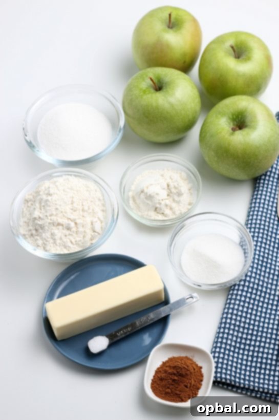 Rustic Apple Tart 5 Assortment of fresh ingredients laid out, including apples, flour, sugar, and butter, ready for making the apple crostata recipe.