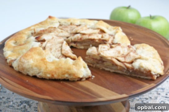 Rustic Apple Tart 9 A close-up of a rustic apple crostata, simple, sweet, and perfectly filled, highlighting freshly picked fall apples.