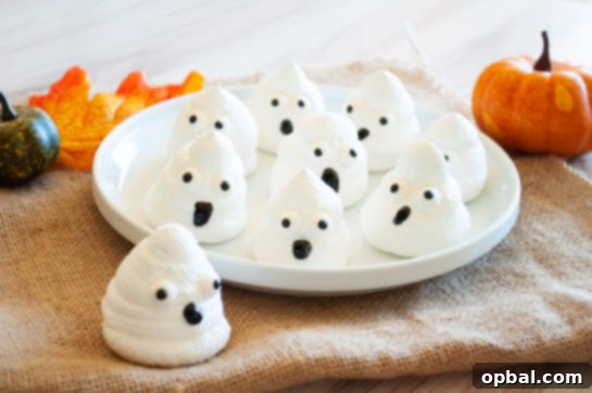 Spook-tacular Meringue Bites 10 Assortment of finished Halloween Boo Meringues ready for a party.