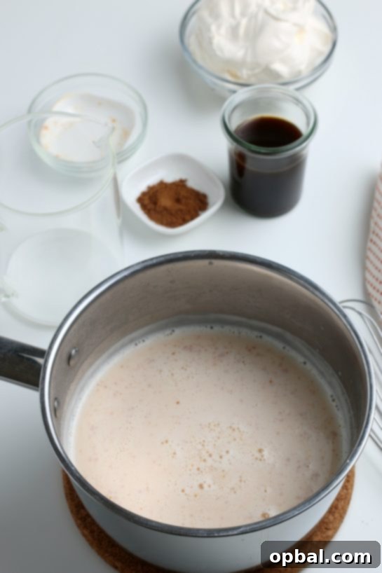 Cozy Autumn Pumpkin Spice Latte 7 Adding the whole milk to the pot to make my Homemade Pumpkin Spice Latte recipe