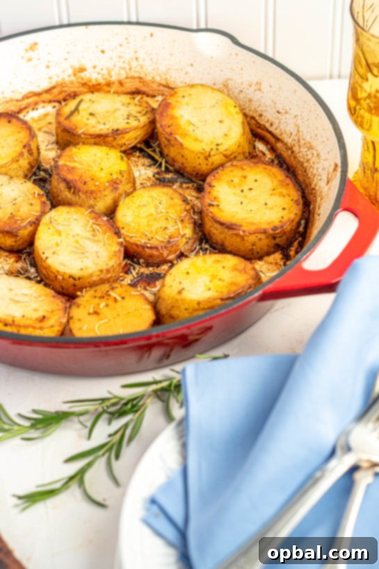 Velvet Roasted Potatoes 16 Festive platter of melting potatoes, garnished with fresh herbs, ready for a holiday table.