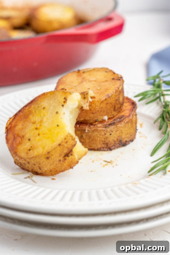 Velvet Roasted Potatoes 3 Golden brown melting potatoes, caramelized and glistening in a roasting pan.