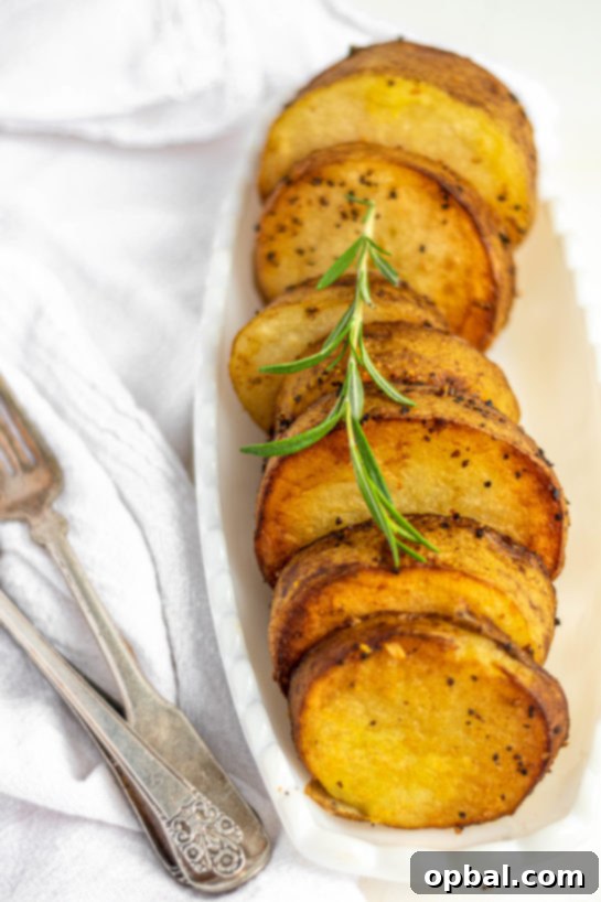 Velvet Roasted Potatoes 4 Close-up of a single melting potato slice, perfectly golden and tender.