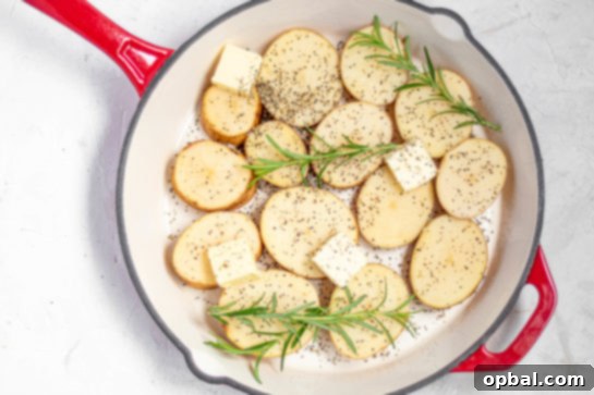 Velvet Roasted Potatoes 9 Melted butter shimmering in a hot oven-safe skillet, ready for potatoes.