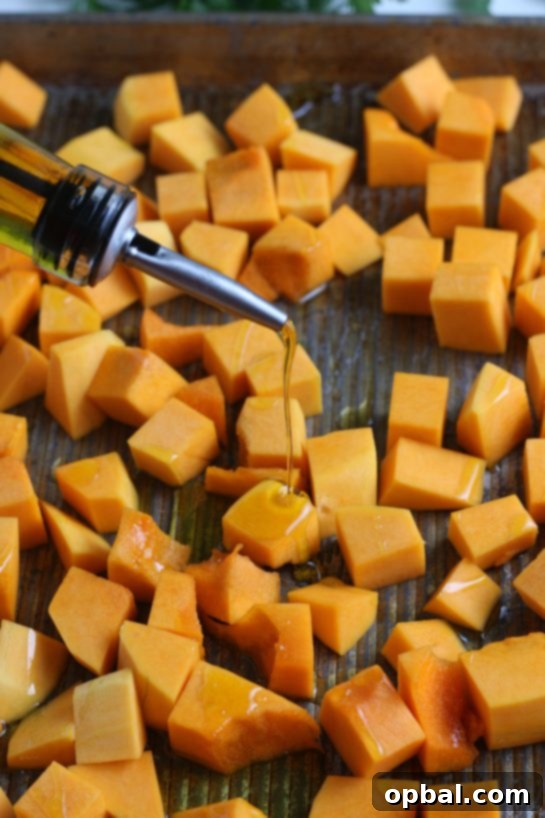 Sweet Caramelized Butternut 7 Placing the diced butternut squash on the pan for the roasted butternut squash recipe
