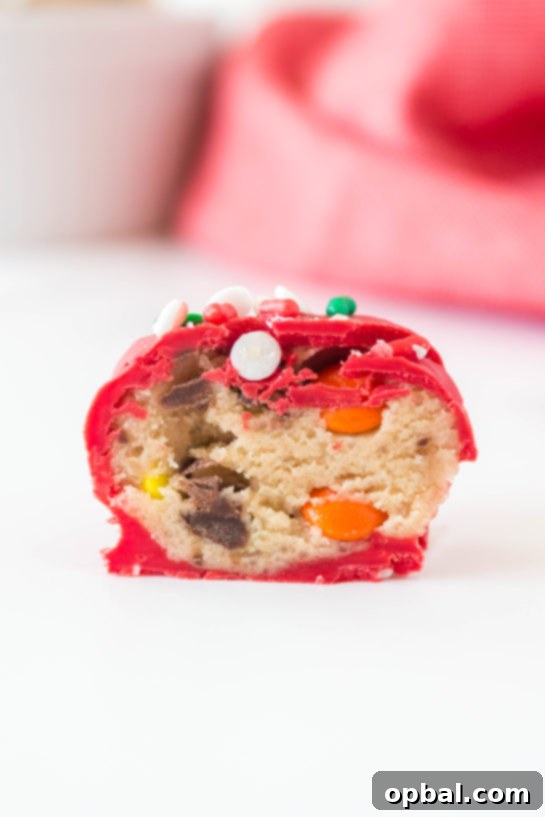 Decadent Dough Bites 15 A delightful close-up of Christmas Edible Cookie Dough Balls, showcasing their festive appeal