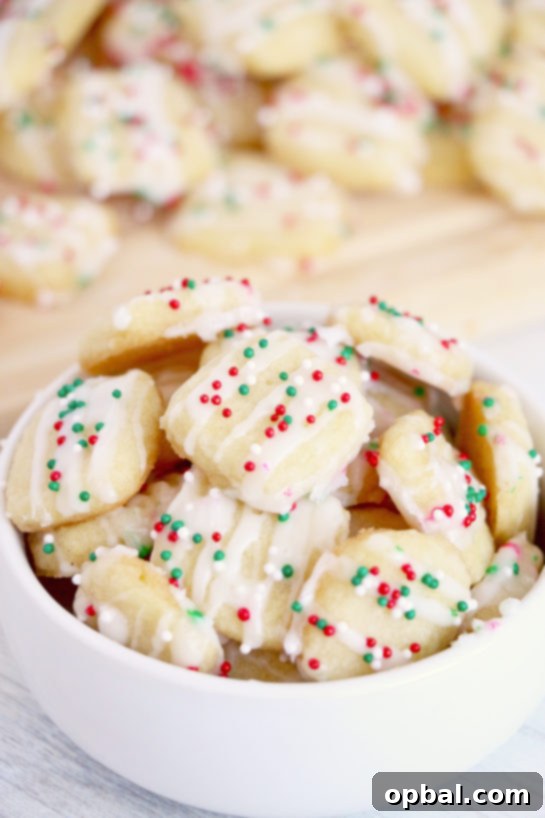 Merry Little Sugar Cookies 2 Bite-size soft and buttery Christmas Christmas Sugar Cookie Bites are one of my favorite Christmas desserts and a unique take on a classic frosted sugar cookie!