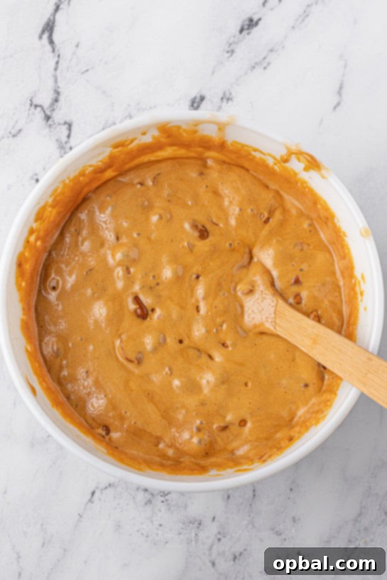 Quick Microwave Peanut Brittle 10 Mixing together the ingredients needed to make the Microwave Peanut Brittle recipe