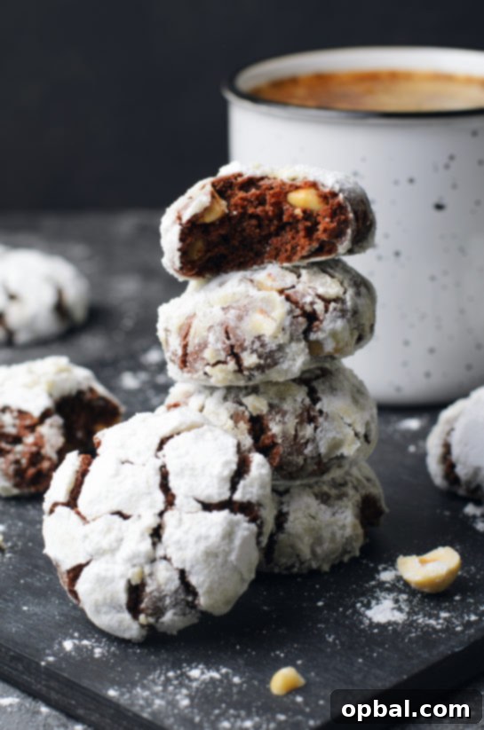 Cracked Chocolate Hazelnut Delights 2 Classic Chocolate Hazelnut Crinkle Cookies recipe are rich, chewy cookies with hazelnuts, cocoa, and chocolate. They are irresistible cookies for Christmas and only a few simple steps to make!