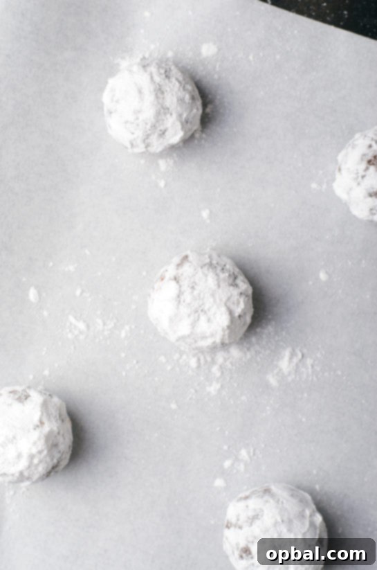 After rolling the cookies in powdered sugar for the chocolate hazelnut crinkle cookies recipe