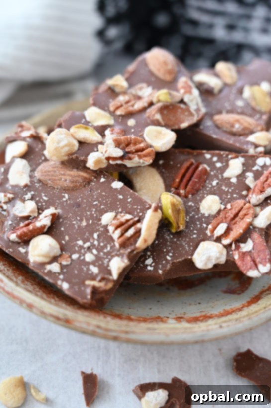 Close up, plated 5-ingredient Salted Chocolate Almond Hazelnut Bark, an excellent edible gift.