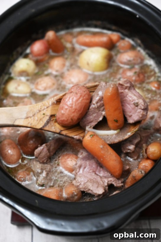 Effortless Slow Cooker Beef Stew 3 This easy Crock Pot Beef Stew recipe is made with tender beef, root vegetables, and a rich, aromatic sauce, making it the perfect family meal.