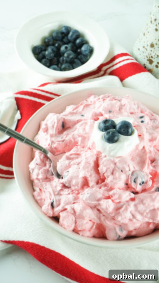 Stars and Stripes Fluff Bliss 2 Vibrant Red, White, and Blue Fluff Salad ready to serve, a perfect no-bake dessert for summer parties.