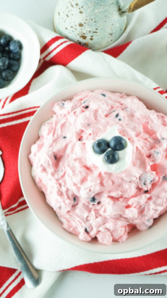 Stars and Stripes Fluff Bliss 12 Easy Patriotic Red White and Blue Fluff Salad, a simple yet elegant dessert for any party or picnic.