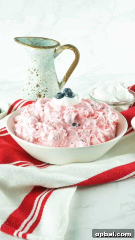 Stars and Stripes Fluff Bliss 13 A large bowl of the easy Red White and Blue Fluff Salad ready for serving at a picnic or potluck.