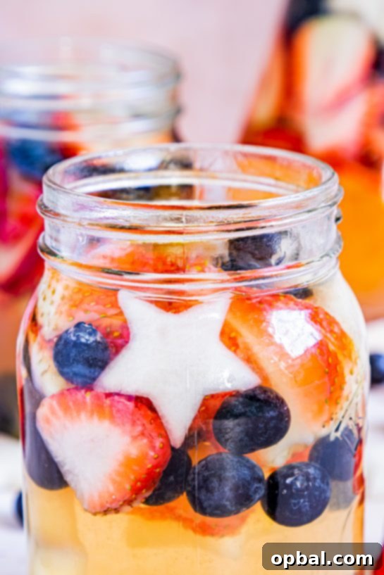 Freedom Sangria 13 Close-up of a glass of refreshing Patriotic Sangria, showcasing the vibrant fruit and cool beverage, ready for a summer celebration.
