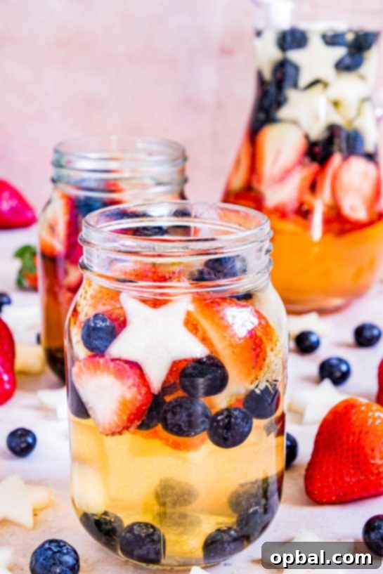 Freedom Sangria 7 A festive glass of red, white, and blue sangria with fruit, perfect for a Flag Day, 4th of July, or Memorial Day celebration.