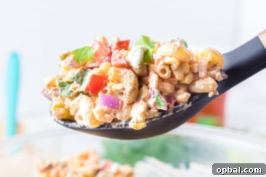 Elote Pasta Salad 11 Close-up shot of Mexican Street Corn Pasta Salad is light and healthy, yet so delicious. It’s the perfect side or main dish for a big gathering or just a quick dinner during the week with a Mexican twist!