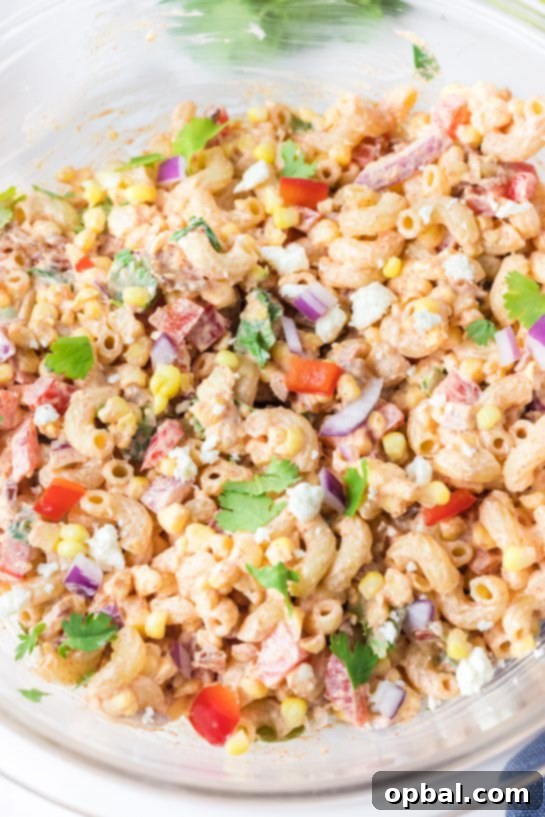 Elote Pasta Salad 12 Close-up photo of Mexican Street Corn Pasta Salad, showcasing its light and healthy appeal, yet incredibly delicious flavor. Perfect as a versatile side or main dish.